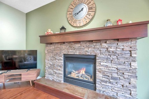331 Mahogany Court Se, Calgary, AB - Indoor Photo Showing Living Room With Fireplace