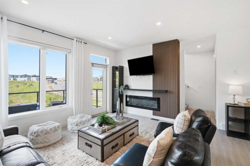 108 Na'A Heights Sw, Calgary, AB - Indoor Photo Showing Living Room With Fireplace
