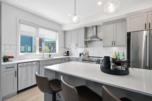 108 Na'A Heights Sw, Calgary, AB - Indoor Photo Showing Kitchen With Stainless Steel Kitchen With Upgraded Kitchen