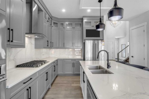32 Waterford Terrace, Chestermere, AB - Indoor Photo Showing Kitchen With Double Sink With Upgraded Kitchen