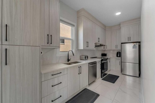 32 Waterford Terrace, Chestermere, AB - Indoor Photo Showing Kitchen With Double Sink