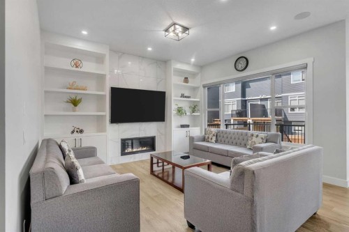 32 Waterford Terrace, Chestermere, AB - Indoor Photo Showing Living Room With Fireplace