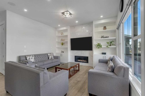 32 Waterford Terrace, Chestermere, AB - Indoor Photo Showing Living Room With Fireplace