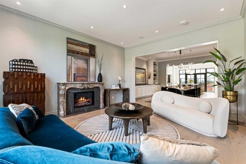 82 Valour Circle Sw, Calgary, AB - Indoor Photo Showing Living Room With Fireplace