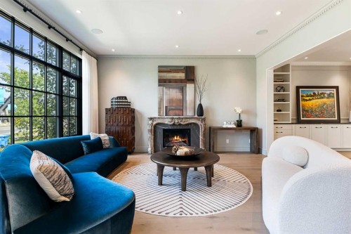 82 Valour Circle Sw, Calgary, AB - Indoor Photo Showing Living Room With Fireplace