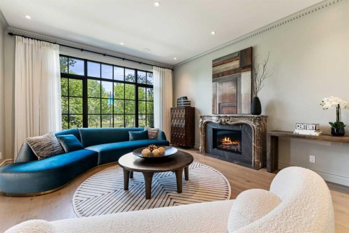 82 Valour Circle Sw, Calgary, AB - Indoor Photo Showing Living Room With Fireplace