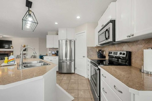13061 Coventry Hills Way Ne, Calgary, AB - Indoor Photo Showing Kitchen With Stainless Steel Kitchen With Double Sink With Upgraded Kitchen
