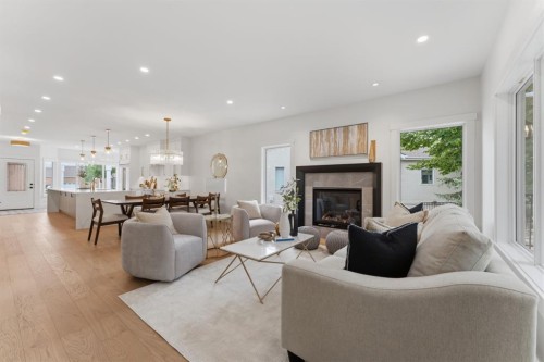 12 Prominence Point Sw, Calgary, AB - Indoor Photo Showing Living Room With Fireplace