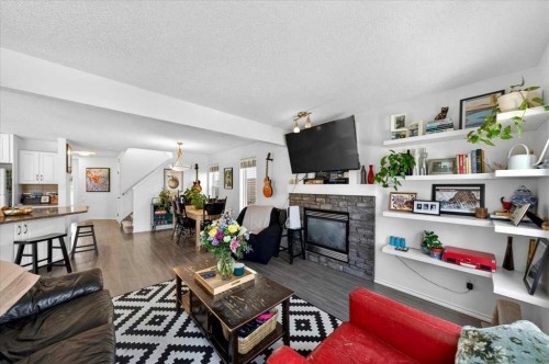 194 Everoak Gardens Sw, Calgary, AB - Indoor Photo Showing Living Room With Fireplace
