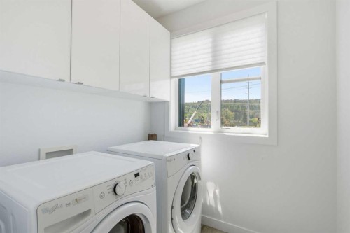 2-4733 17 Avenue Nw, Calgary, AB - Indoor Photo Showing Laundry Room