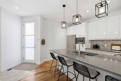 2-4733 17 Avenue Nw, Calgary, AB - Indoor Photo Showing Kitchen With Double Sink With Upgraded Kitchen