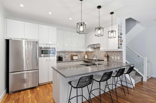 2-4733 17 Avenue Nw, Calgary, AB - Indoor Photo Showing Kitchen With Stainless Steel Kitchen With Double Sink With Upgraded Kitchen
