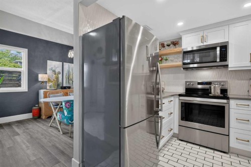 107-1615 13 Avenue Sw, Calgary, AB - Indoor Photo Showing Kitchen With Stainless Steel Kitchen