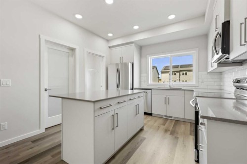 36 Heartwood Lane Se, Calgary, AB - Indoor Photo Showing Kitchen With Upgraded Kitchen