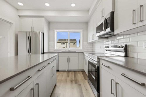 36 Heartwood Lane Se, Calgary, AB - Indoor Photo Showing Kitchen With Upgraded Kitchen