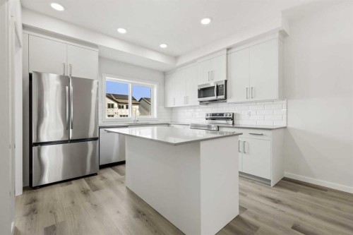 36 Heartwood Lane Se, Calgary, AB - Indoor Photo Showing Kitchen With Upgraded Kitchen