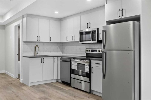 36 Heartwood Lane Se, Calgary, AB - Indoor Photo Showing Kitchen With Upgraded Kitchen