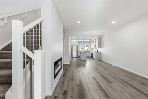 36 Heartwood Lane Se, Calgary, AB - Indoor Photo Showing Other Room With Fireplace
