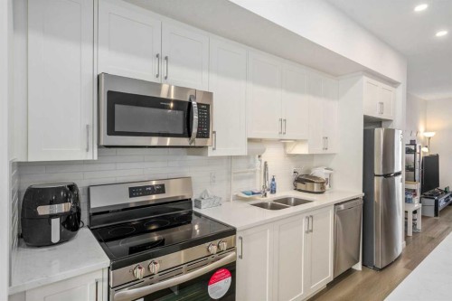 628 Copperstone Manor Se, Calgary, AB - Indoor Photo Showing Kitchen With Stainless Steel Kitchen With Double Sink With Upgraded Kitchen