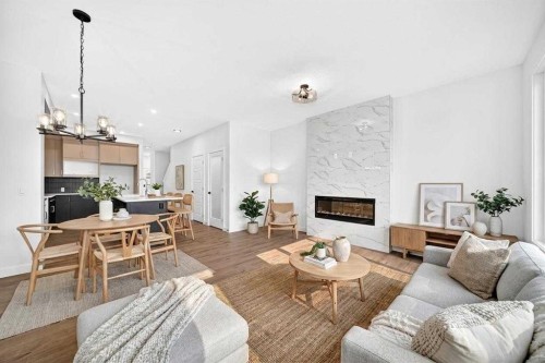182 Lanark Gate Se, Airdrie, AB - Indoor Photo Showing Living Room With Fireplace