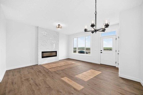 182 Lanark Gate Se, Airdrie, AB - Indoor Photo Showing Living Room With Fireplace