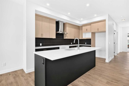 182 Lanark Gate Se, Airdrie, AB - Indoor Photo Showing Kitchen With Double Sink