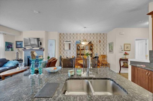 226 Sunset Point, Cochrane, AB - Indoor Photo Showing Kitchen With Double Sink