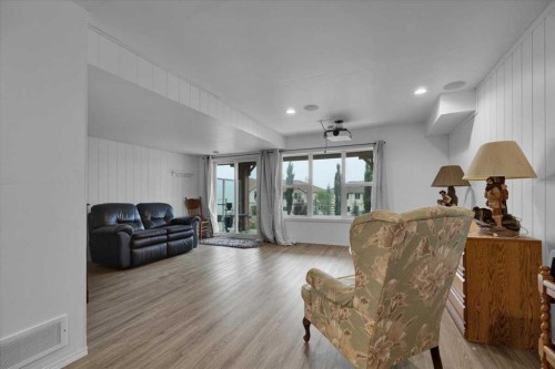 226 Sunset Point, Cochrane, AB - Indoor Photo Showing Living Room