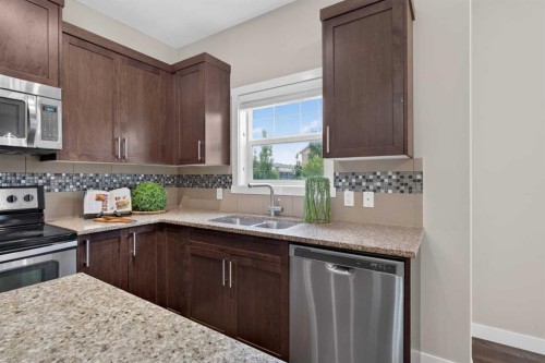558 Evanston Manor Nw, Calgary, AB - Indoor Photo Showing Kitchen With Stainless Steel Kitchen With Double Sink