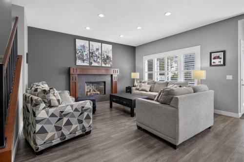 234 Pantego Way Nw, Calgary, AB - Indoor Photo Showing Living Room With Fireplace