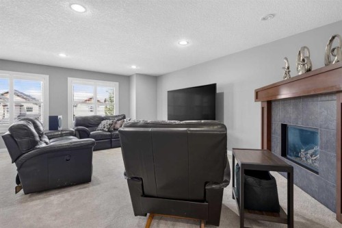 234 Pantego Way Nw, Calgary, AB - Indoor Photo Showing Living Room With Fireplace