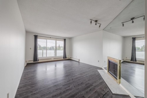 417-333 Garry Crescent Ne, Calgary, AB - Indoor With Fireplace