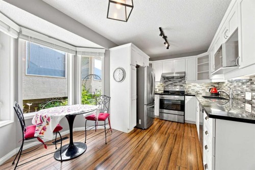 128 Sienna Park Green Sw, Calgary, AB - Indoor Photo Showing Kitchen With Upgraded Kitchen