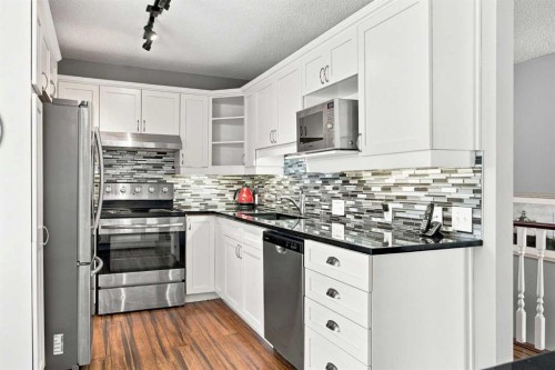 128 Sienna Park Green Sw, Calgary, AB - Indoor Photo Showing Kitchen With Upgraded Kitchen