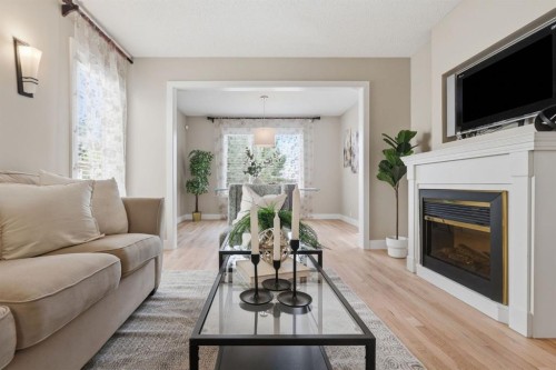 135 Douglas Woods Hill Se, Calgary, AB - Indoor Photo Showing Living Room With Fireplace