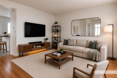 102-1835 10 Avenue Se, Calgary, AB - Indoor Photo Showing Living Room