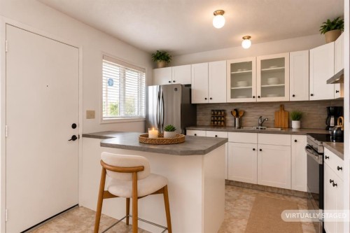 102-1835 10 Avenue Se, Calgary, AB - Indoor Photo Showing Kitchen With Double Sink