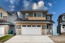 495 Rivercrest View, Cochrane, AB  - Outdoor With Facade 