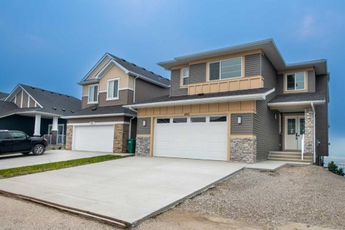 495 Rivercrest View, Cochrane, AB - Outdoor With Facade