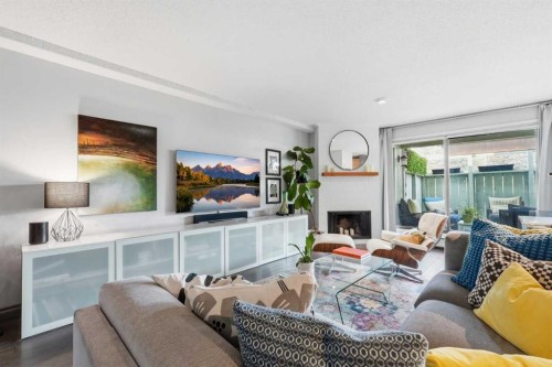 214-10120 Brookpark Boulevard Sw, Calgary, AB - Indoor Photo Showing Living Room With Fireplace
