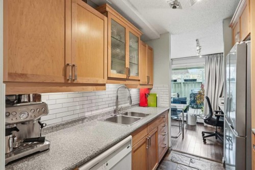214-10120 Brookpark Boulevard Sw, Calgary, AB - Indoor Photo Showing Kitchen With Double Sink