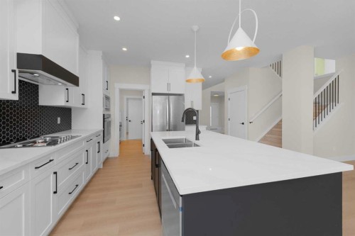 500 Rivercrest View, Cochrane, AB - Indoor Photo Showing Kitchen With Double Sink With Upgraded Kitchen