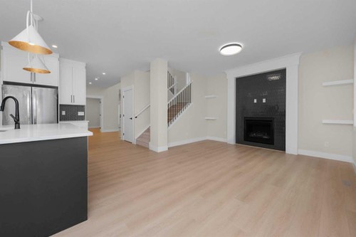 500 Rivercrest View, Cochrane, AB - Indoor With Fireplace