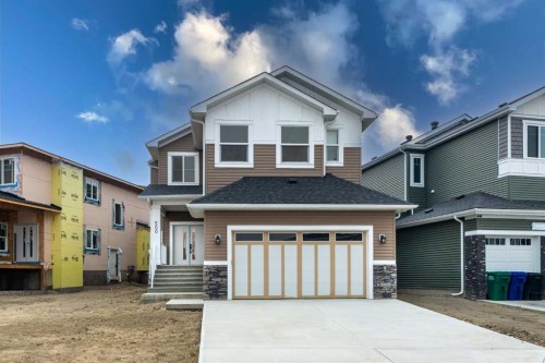 500 Rivercrest View, Cochrane, AB - Outdoor With Facade