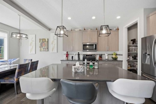 52 Sunrise Way, Cochrane, AB - Indoor Photo Showing Dining Room