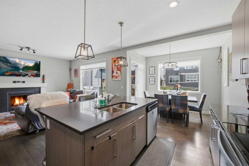 52 Sunrise Way, Cochrane, AB - Indoor Photo Showing Kitchen With Double Sink