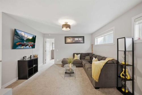 52 Sunrise Way, Cochrane, AB - Indoor Photo Showing Living Room