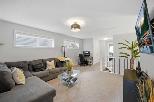 52 Sunrise Way, Cochrane, AB - Indoor Photo Showing Living Room