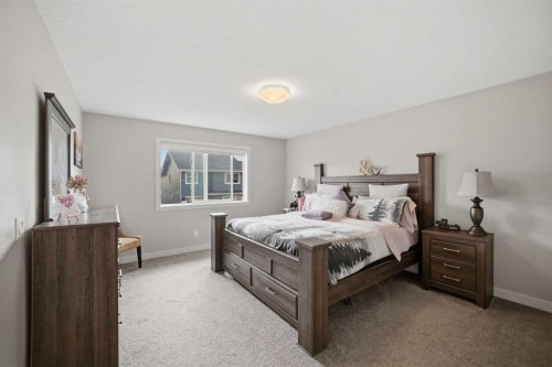 52 Sunrise Way, Cochrane, AB - Indoor Photo Showing Bedroom