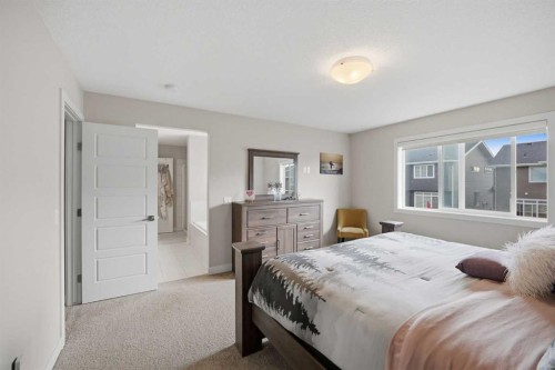 52 Sunrise Way, Cochrane, AB - Indoor Photo Showing Bedroom